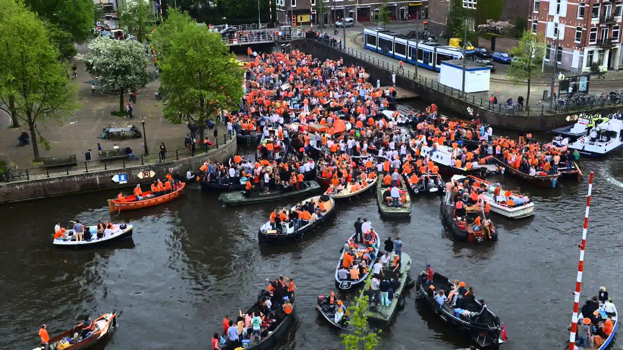 Amsterdam king formerly report orange queen gathered crowds huge party city over